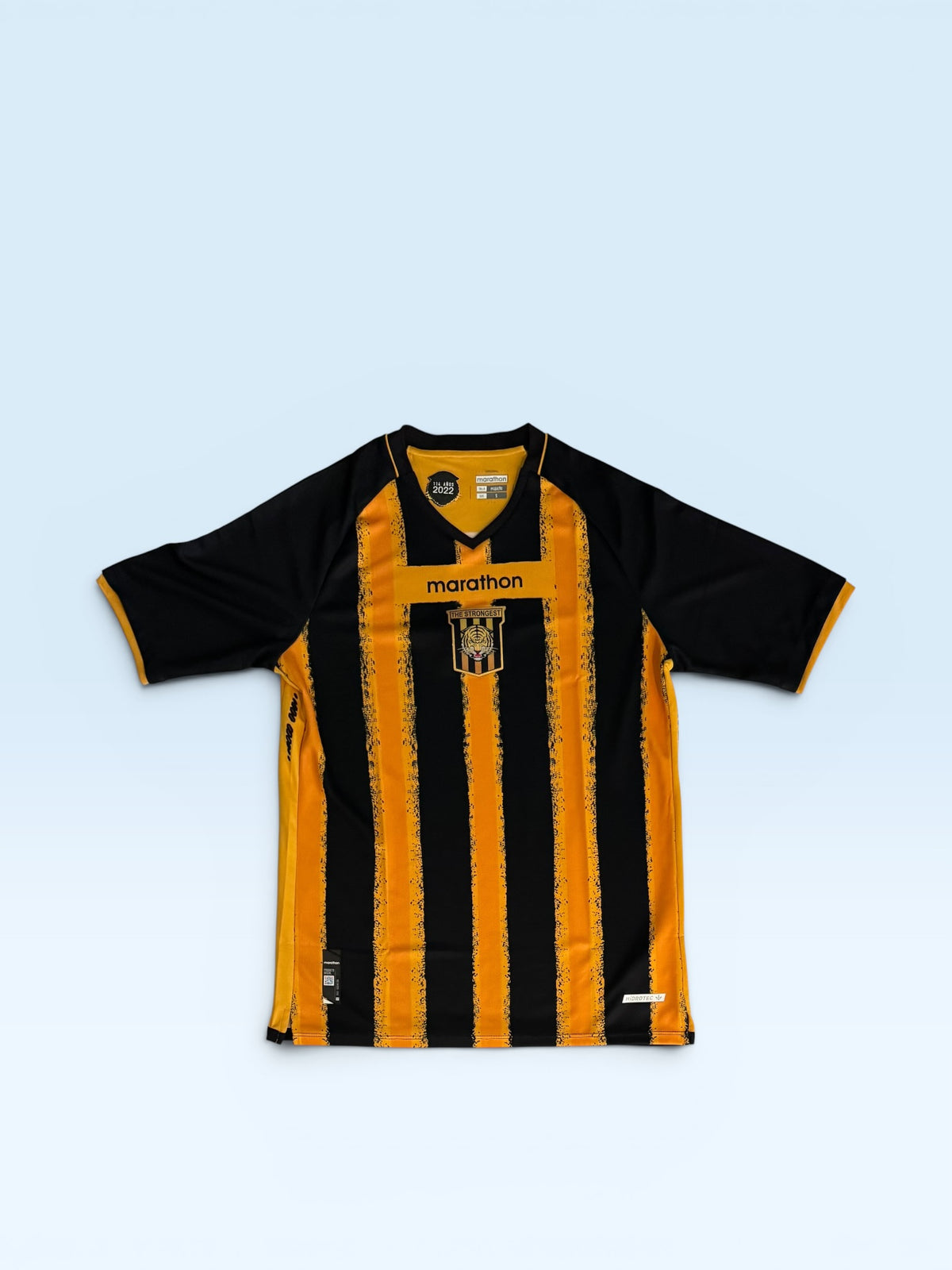The Strongest 2025-26 black and gold home soccer jersey, Bolivia Marathon kit