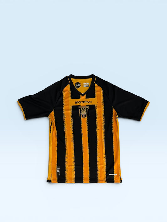 The Strongest 2025-26 black and gold home soccer jersey, Bolivia Marathon kit